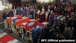 The coffins of the Karadjordjevic family, former Yugoslavia's royal family, lay inside Belgrade's Congregational Church during a religious ceremony before being reburied in Oplenac.