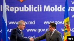 Ministrul economiei Octavian Calmîc și vice premierul rus Dimitri Rogozin, 1 iulie, 2016