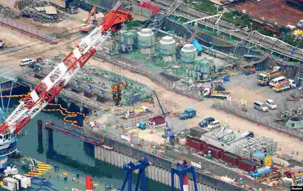 A shore barrier is under construction to stop radioactive water from leaking into the sea. A new containment plan calls for a frozen barrier in the ground, created by liquid coolant, designed to keep ground water from being contaminated.