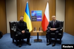 Ukrainian President Volodymyr Zelenskyy (left) and Polish President Karol Nawrocki on the sidelines of a NATO summit in Ankara on July 8.