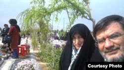 Parents of Mohsen Rouholamini visit the grave of their son, a protester in 2009 who dies in custody in Iran, undated.