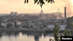 Smoke rises from a shipyard that was hit by a Ukrainian missile attack in Sevastopol on September 13.