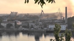 Smoke rises from a shipyard that was hit by a Ukrainian missile attack in Sevastopol on September 13.