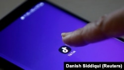  The TikTok app's logo seen on a mobile phone screen. 