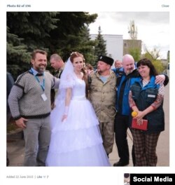 The man on the far left is the unidentified OSCE staffer and the woman on the far right is a translator who used to work and teach at Luhansk University, according to journalist Yevhen Spirin.