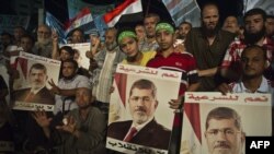 Supporters of Egypt's deposed president, Muhammad Morsi, gather during their open sit-in outside Rabaa al-Adawiya Mosque in Cairo on August 1.