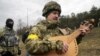 UKRAINE – Taras Kompanichenko, a well-known Ukrainian artist and a volunteer of the Territorial Defense Forces at a checkpoint in Kyiv, March 6, 2022