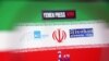 The logos for the Yemen Press News Agency, Sudan Today, Nile Net Online and AWDnews websites are seen against an Iranian flag in a picture illustration taken November 29, 2018. Picture taken November 29, 2018. To match Special Report CYBER-IRAN/ REUTER