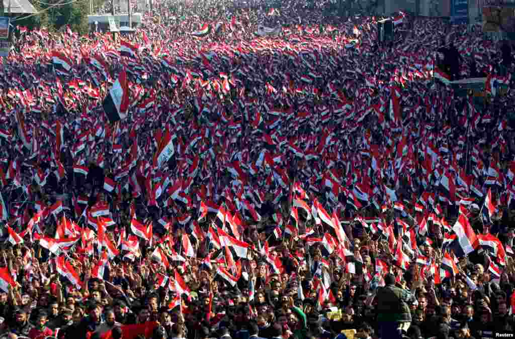 Supporters of prominent Iraqi Shi'ite cleric Moqtada al-Sadr shout slogans during a protest against corruption at Tahrir Square in Baghdad, Iraq, on February 26. (Reuters/Alaa Al-Marjani)
