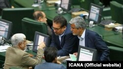 Members of the Iranian parliament talking during a session in August 2017. Mahmoud Sadeghi is seen on the right.