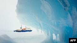 A photo by passenger Andrew Peacock from December 30 of the Russian research vessel "MV Akademik Shokalsky" stuck in the ice off East Antarctica awaiting rescue.