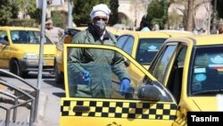 Taxi driver wearing protective mask against coronavirus in Kerman, Iran. FILE PHOTO