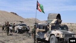 Afghanistan -- Members of the Afghan security services patrol following an operation against Islamic State militants (IS) in Achin district of Nangarhar province, Februaury 17, 2016