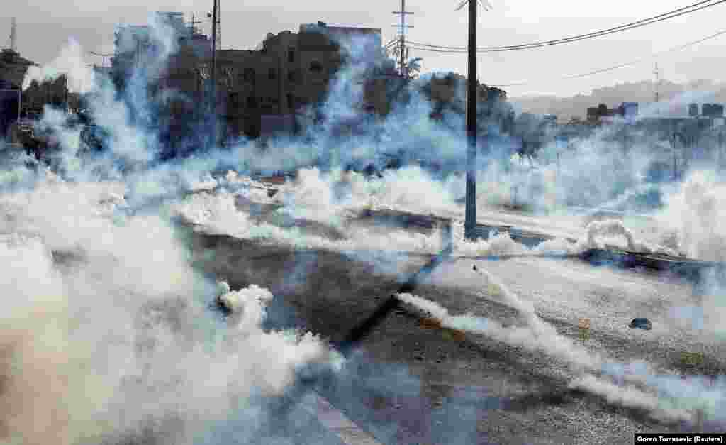 Israeli forces fire gas canisters at Palestinian protesters during a protest in the West Bank city of Bethlehem. (Reuters/Goran Tomasevic)