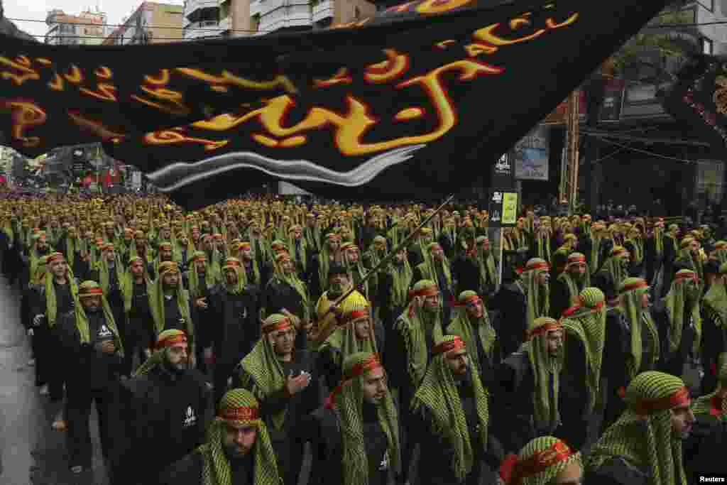 Lebanese Hizballah supporters march during a religious procession to mark Ashura in Beirut's suburbs. (Reuters/Aziz Taher)