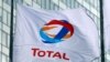 FRANCE -- FILE PHOTO: The logo of French oil giant Total on a flag at La Defense business and financial district in Courbevoie near Paris, France. May 16, 2018.