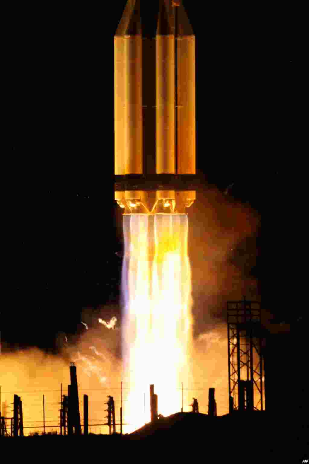 NOVEMBER 3, 2012 -- A Proton-M rocket blasts off from the Russian-leased Baikonur cosmodrome in Kazakhstan before successfully placing two communications satellites in orbit. A previous launch of a Proton-M in August failed. Two telecommunications satellites did not reach their planned orbits due to a malfunction in the rocket's upper stage.