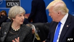 British Prime Minister Theresa May (left) spoke to U.S. President Donald Trump on May 25 to say intelligence shared between their two countries had to remain secure.