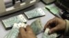 Banknotes are counted at Lebanon's Central Bank in Beirut, which in the early going has managed to steer clear of much of the fallout from the global financial crisis.