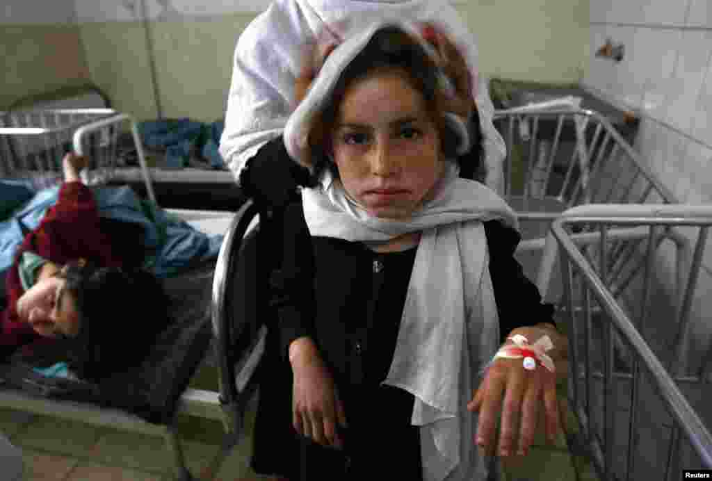 A schoolgirl in a Kapisa hospital after she was poisoned at an area school in May 2009. Taliban fighters have maintained their violent opposition to education for women, frequently targeting schools with bombings or poisonings.