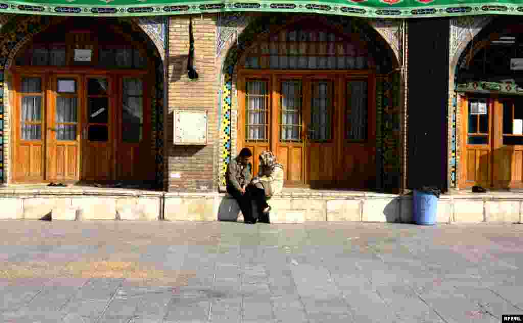 A young couple chats outside the Imamzade Ismayil Mausoleum. - (Photos by RFE/RL Azerbaijani Service correspondent Abbas Atilay)