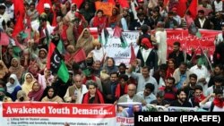 Pakistani students shout slogans during a protest to demand the government a rollback of education budget cuts and the reinstatement of student elections in Lahore on November 29.
