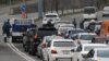 Armenia -- Police officers enforcing a coronavirus lockdown check cars leaving Yerevan, April 1, 2020.