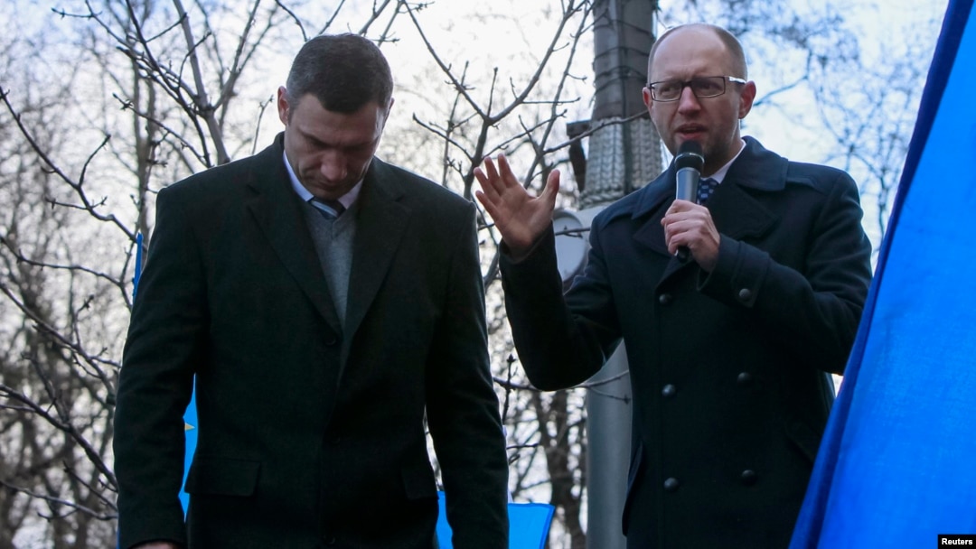 Opposition leaders Arseniy Yatsenyuk (right) and Vitali Klitschko speak during a rally in support of EU integration in front of the Cabinet of Ministers building in Kyiv last week