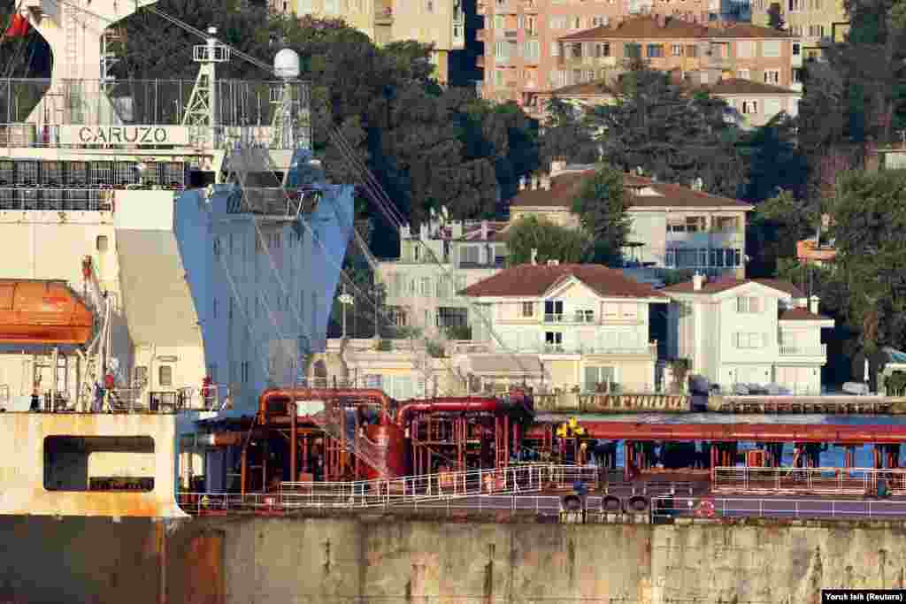Some ships operating on the Black Sea, such as the Caruzo oil tanker (pictured) that passed through the Bosphorus on August 11, have been photographed with anti-drone netting draped from crew quarters.<br><br><a href="https://www.fotoio.com/?page_id=425" target="_self" class="wsw__a"><strong>Mehmet Yapici</strong></a>, an Istanbul-based marine photographer, told RFE/RL that among shipspotters, "the general consensus is that equipping ships with anti-drone nets would not be effective" against attack drones.