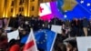 An EU delegation addresses a crowd of protesters in Tbilisi on November 11. 