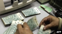 Banknotes are counted at Lebanon's Central Bank in Beirut, which in the early going has managed to steer clear of much of the fallout from the global financial crisis.