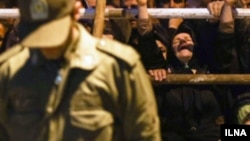 File photo - A woman in Iran crying at the scene of an execution.