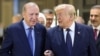 Turkish President Recep Tayyip Erdogan (L) welcomes US President Donald Trump (R) upon his arrival at Etimesgut Air Base near Ankara, on July 7, 2026, before attending the 36th NATO Heads of State and Government Summit.
