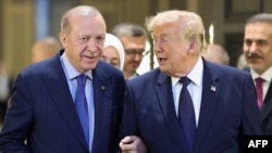 Turkish President Recep Tayyip Erdogan (L) welcomes US President Donald Trump (R) upon his arrival at Etimesgut Air Base near Ankara, on July 7, 2026, before attending the 36th NATO Heads of State and Government Summit.
