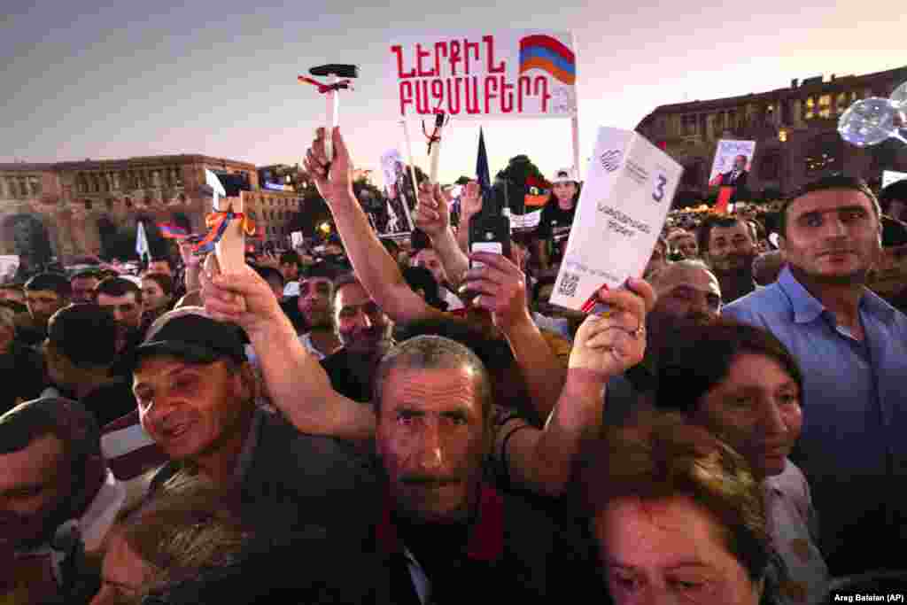 Supporters of Armenian Prime Minister Nikol Pashinian attend an election rally in the center of Yerevan on June 17.