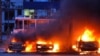 Vehicles blaze following a Russian strike on an industrial district of Zaporizhzhya, Ukraine, on January 8.