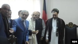 Afghan President Ashraf Ghani, second right, stands with, from left, Vice President Abdul Rashid Dostum, Chief Executive Dr. Abdullah Abdullah and Muhammad Mohaqiq, the deputy to Abdullah Abdullah, in 2014.