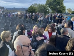 Tina Bokuchava (center with blonde hair), the chair of the opposition United National Movement, greets supporters at the rally in Kvareli.