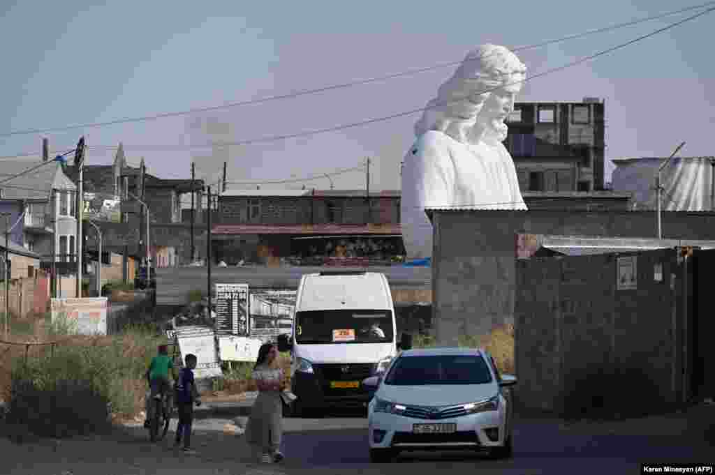 A portion of a massive sculpture of Christ under construction in a suburb of Yerevan, Armenia, on August 26. Sculptor Armen Samvelyane is working on the monument, which is due to be placed atop a 44-meter-high pedestal on the summit of Mount Hatis, near Yerevan.Photo by Karen Minasyan/AFP.