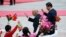 Afghan President Ashraf Ghani and Chinese President Xi Jinping (R) wave to students outside the Great Hall of the People, in Beijing, October 2014.