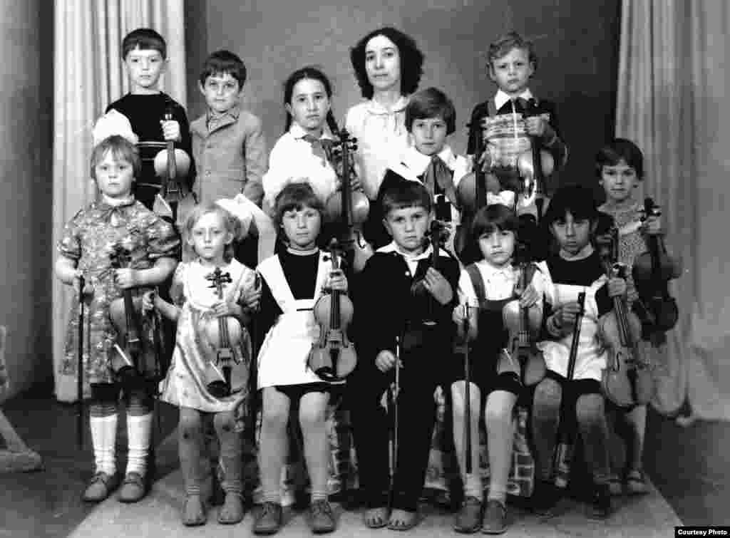Some participants were eager to dispel what they saw as Western misperceptions about life in the Soviet Union. Lilia Bigeyeva (top center, with a group of students), a well-known violinist and composer from Dnipropetrovsk, lost several relatives to Communist repressions. But she says her family, which includes numerous musicians and artists, has a joyful side, as well. "People think there was no laughter behind the Iron Curtain," she says. "But there was a lot!" 