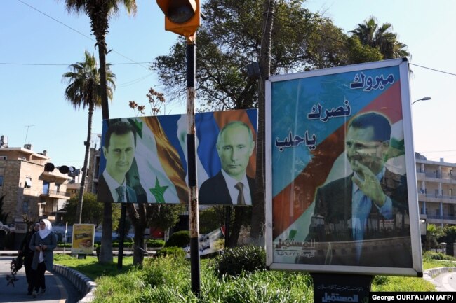 Портреты Башара Асада, Владимира Путина и лидера проиранской "Хезболлы" Хасана Насраллы в Дамаске. 2020 год