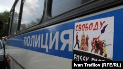 A sticker reading "Free Pussy Riot" on a police vehicle in Moscow.