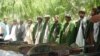 Taliban militants lay down their arms in the Baghlan Province in May