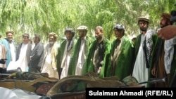 Taliban militants lay down their arms in the Baghlan Province in May