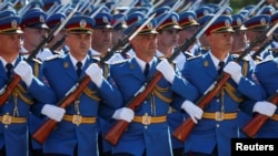 Serbian soldiers march during a military parade in Belgrade on September 20. 