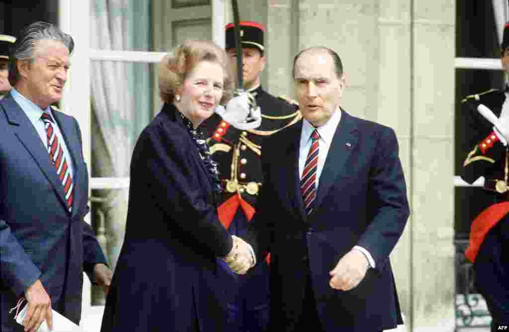 French President Francois Mitterrand and Foreign Minister Roland Dumas (left) welcome Prime Minister Margaret Thatcher in front of the Elysee Palace in Paris in May 1984.