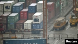 Shipping containers ready and waiting at the Shanghai port.