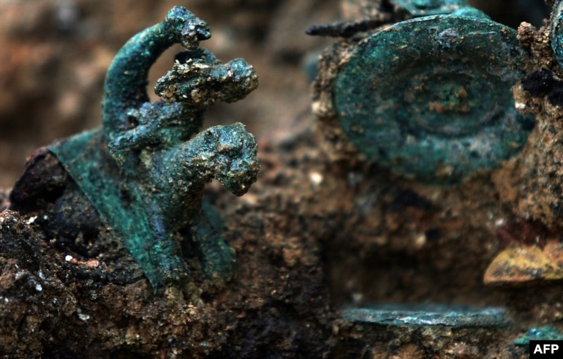 A detail of the Karanovo chariot showing the bronze figurine of a boy riding an unidentified beast