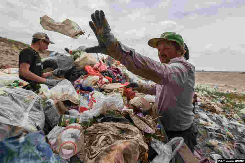 Men at a landfill in the Almaty region of Kazakhstan.